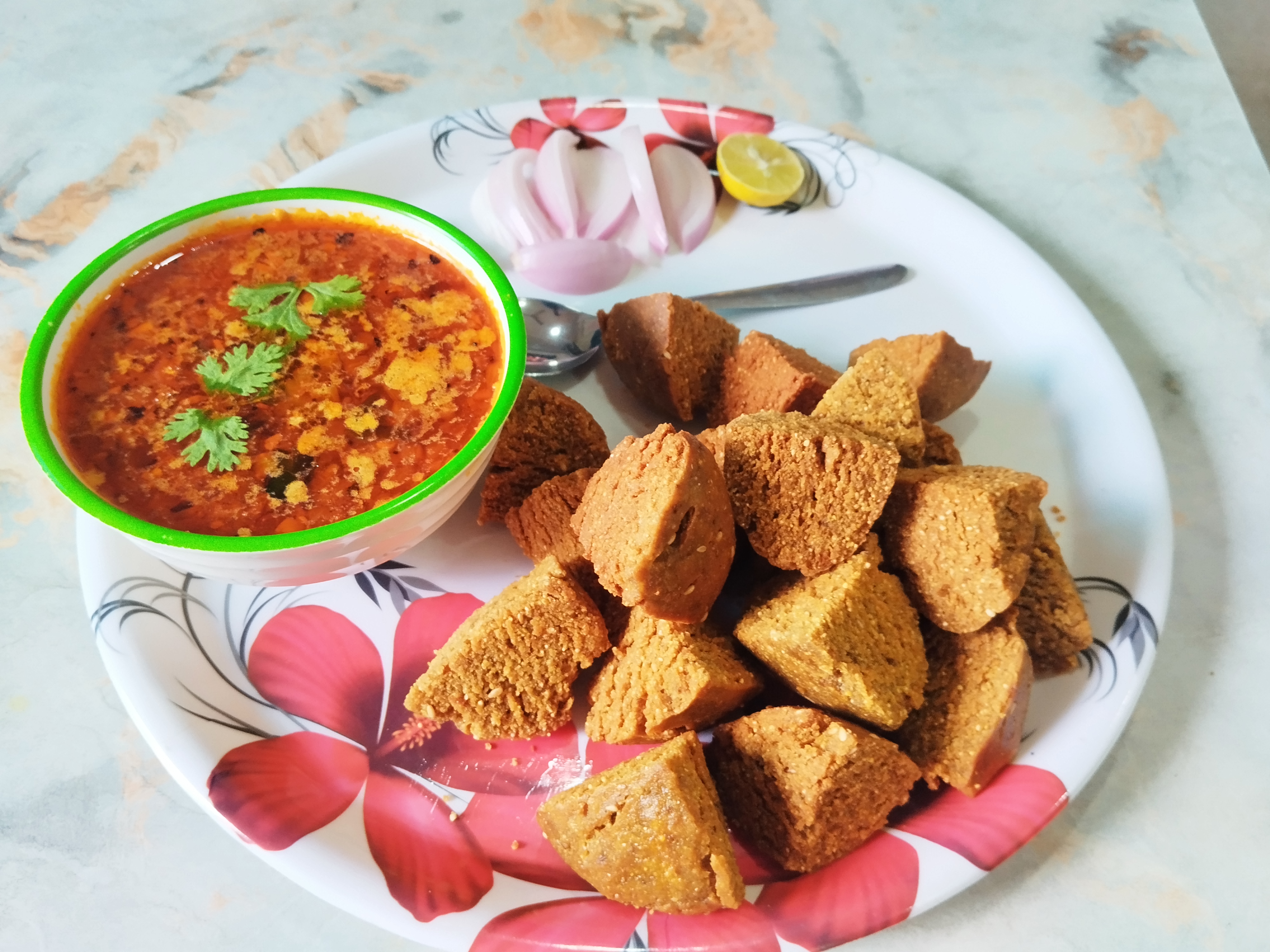 Dal Batti Premix served with dal, onion and lime